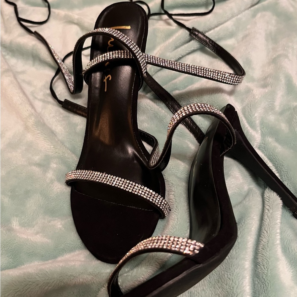 Black strap up heels